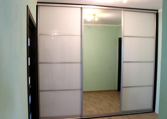 Wardrobe with sliding doors. Furniture. Interior design.