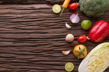 Fototapeta na wymiar Vegetables on wood. Bio Healthy food, herbs and spices. Organic vegetables on wood