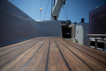 Wooden deck on the yacht. Rest on the water.