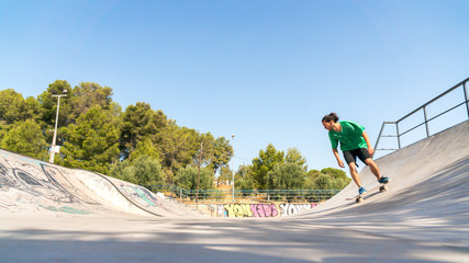 Man skating with skateboard on a skatepark