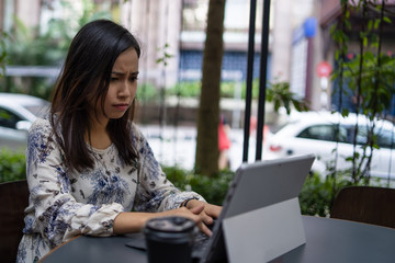 a chinese girl using a laptop