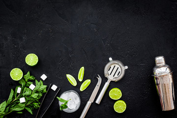 Ingredients and crockery for making mojito. Slices of lime, mint, sugar cubes, glass with ice...