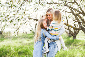 Happy family. mother of many children and three daughters child girl summer outdoors