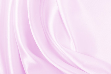 Obraz premium Smooth elegant pink silk or satin texture as wedding background. Luxurious background design