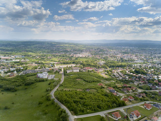 Fototapeta na wymiar Panorama from a bird's eye view. Central Europe: The Polish town of Jaslo is located among the green hills. Temperate climate. Flight drones or quadrocopter.