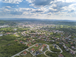 Panorama from a bird's eye view. Central Europe: The Polish town of Jaslo is located among the green hills. Temperate climate. Flight drones or quadrocopter.