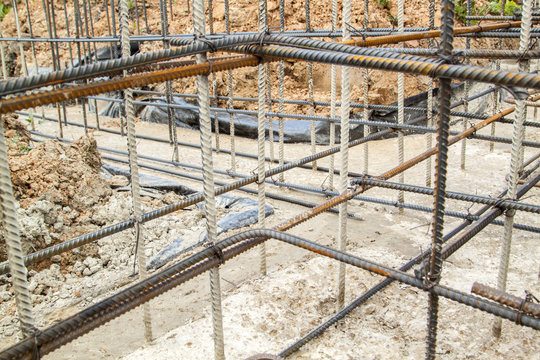 reinforcement of concrete with metal rods connected by wire. Preparation for pouring the Foundation