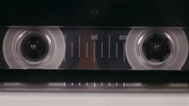 Player fast forward reeling an audio cassette - retro player closeup, timelapse