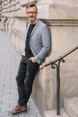 Portrait of mature man with grey jacket