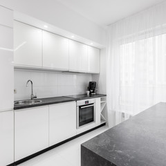 White kitchen with granite countertop