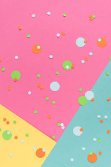 Vibrant confetti on multicolored background