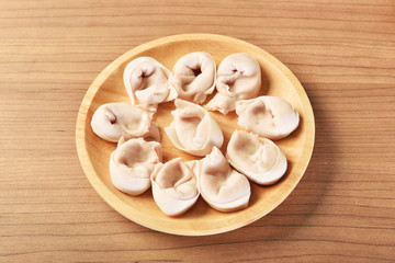 Fototapeta na wymiar Fish dumplings on wooden plate