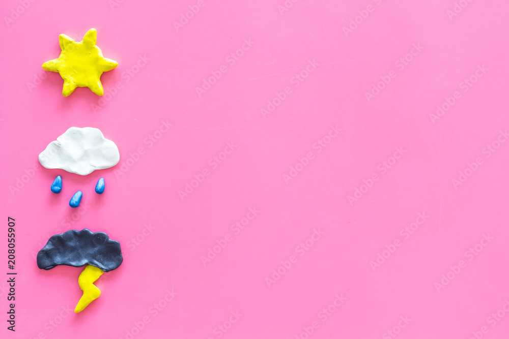 Wall mural weather forecast concept. modern weather icons set on pink background top view copy space