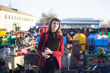 female selling spare parts in outdoor store