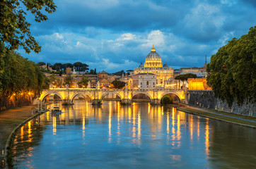 Evening view of Basilica St Peter and bridge Sant Angelo in Vatican City Rome Italy. Rome...