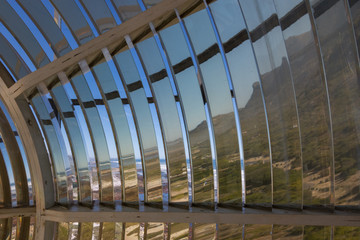 Unusual view from the inside of the Fresnel lens of the Slangkop lighthouse in South Africa