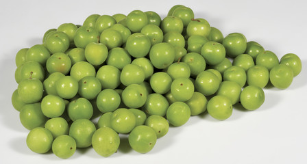 Green plums on white
