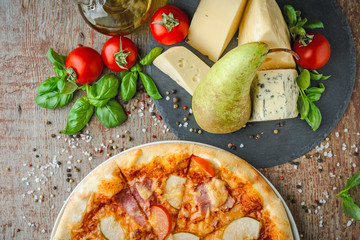 Appetizing Hawaiian pizza with a pear