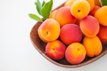 fresh apricots on white background