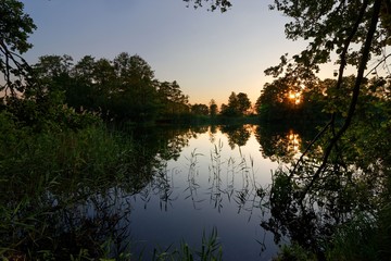Fototapeta na wymiar Lake during sunset