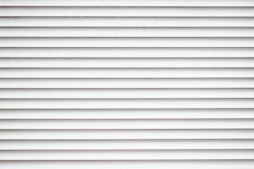 Texture of closed window blind is close