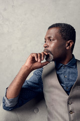 portrait of thoughtful stylish african american man in waistcoat