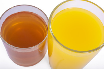 Two glasses of fresh orange and apple juice isolate