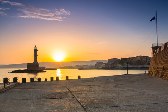 Lighthouse of the old Venetian port in Chania at sunrise, Crete. Greece