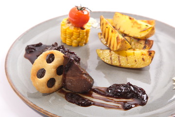 Tongue in sauce on plate