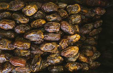 Dried fruits in a box on a shelf in a supermarket are not packaged.