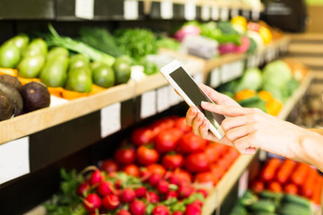 Beautiful Young Woman Groceries Shopping In Local Supermarket