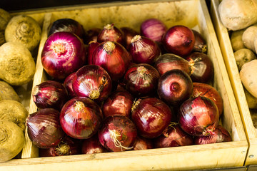 Seasonal and exotic fruits and vegetables on the food shelf in the supermarket