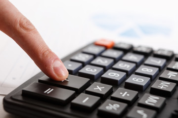 Business people use their fingers to compute calculations