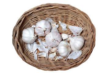 Garlic in the basket on white background and path.