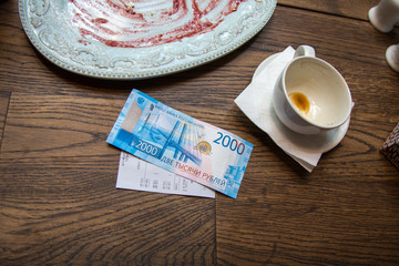 New 2000 russian rubles banknote on the table on cafe.
