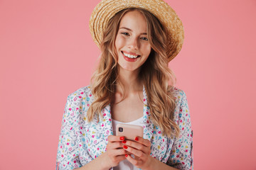 Portrait of a happy young woman in summer dress