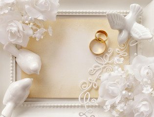 wedding background with empty photo frame and wedding rings