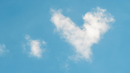 Cloud in a heart shape on a blue background.