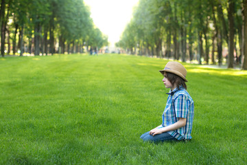 Fototapeta premium The boy has a difficult age, he is upset about something