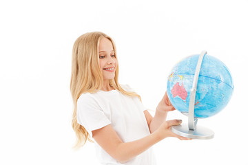 Fototapeta premium Picture of Smiling blonde girl in casual clothes holding globe