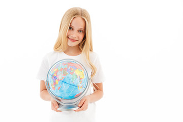 Happy young blonde girl in casual clothes holding globe
