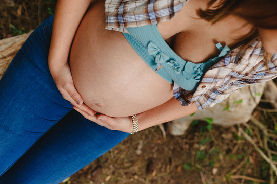 Pictures of the belly of pregnant women in nature with natural background