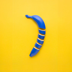 Banana cut / Creative still life photo of cut blue banana on yellow background.