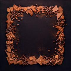 Chocolate frame / Creative concept photo of frame made of chocolate on black background.