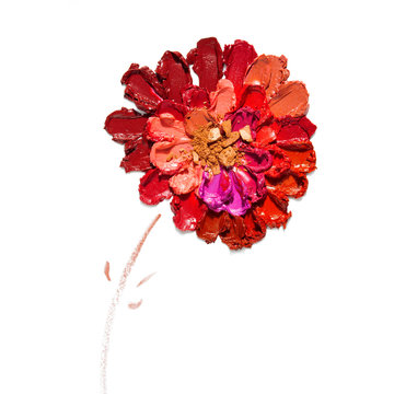 Cosmetic swatch / Creative concept photo of cosmetics swatches in the shape of flower on white background.