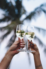 Couple enjoying a glass of wine by the beach