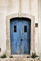Old and colorful wooden door with iron details