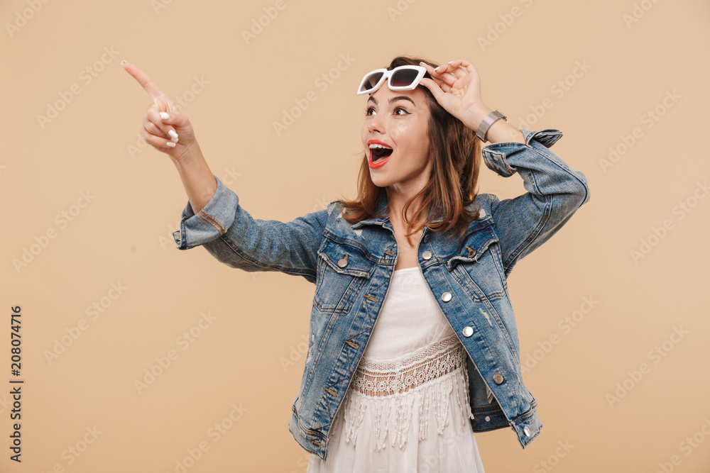 Wall mural Portrait of an excited young girl in summer clothes