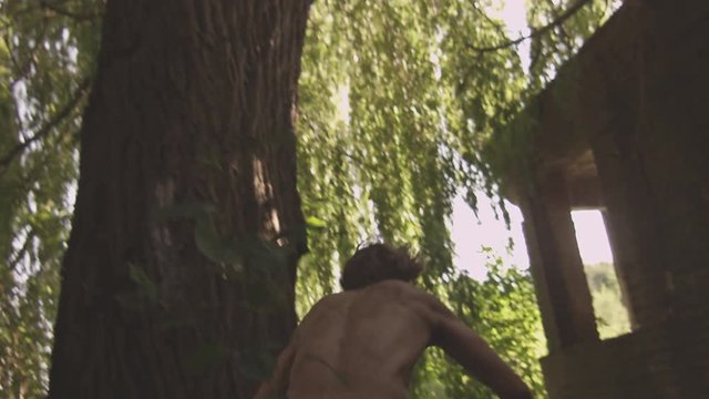 Slowmotion shot of an Freerunner doing a drop 