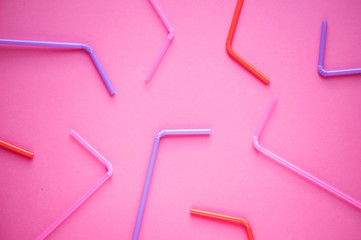 Drinking straws on pink